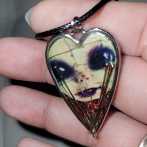 Pinhead face necklace